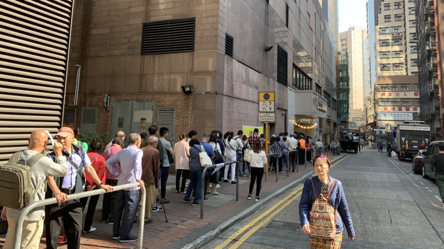 Long lines of voters waited to vote in Hong Kong's district council elections on Sunday. [Emily Feng / NPR]