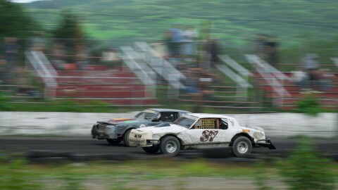 Josh Good (left, gray car) races Jascha