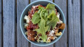 Pasta with sausage, tomato sauce and arugula. (Jesse Costa/WBUR)