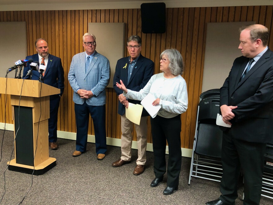 Joe and Elisa Tobia are joined by state lawmakers in Corning to bring attention to rural suicide prevention bill.