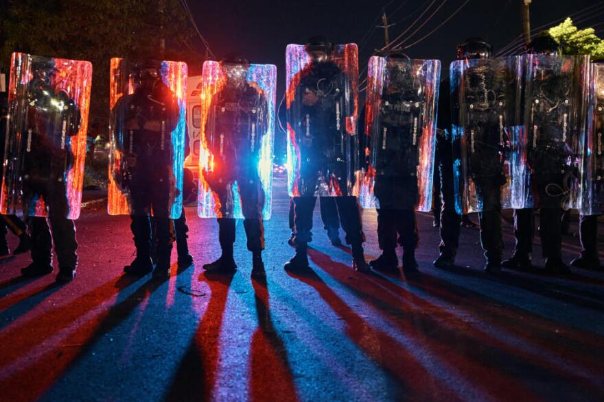 Police stand behind their shields as they prepare to clash with protesters outside the Delaney Hall detention center during a protest against the transfer of detainees and federal immigration policies on Saturday, May 30, 2026, in Newark, N.J. (Andres Kudacki/AP)