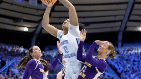 North Carolina forward Nyla Harris (2) drives against Western Illinois forward Mallory Shetley (10) and guard Addi Brownfield (13) during the first half in the first round of the NCAA college basketball tournament Friday, March 20, 2026, in Chapel Hill, N.C.