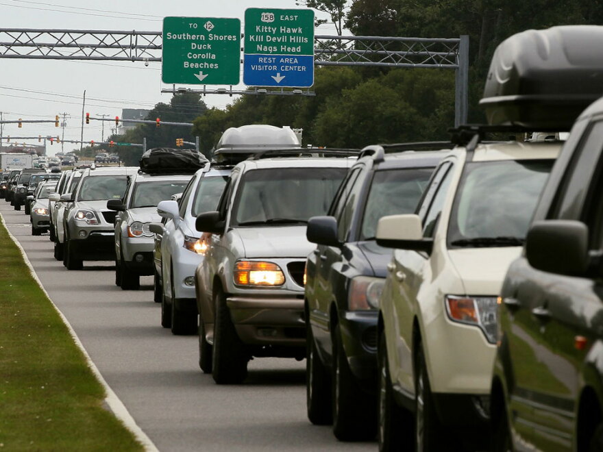Vehicles sit in traffic on the Croatan Highway as people evacuate the Outer Banks area Thursday in Southern Shores, N.C.
