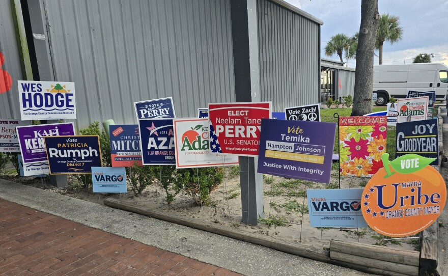Campaign signs greeted visitors to the main hall of the Central Florida Fairgrounds for the Pine Hills Community Council's 2026 Hob Nob and Straw Poll on Wednesday, July 8.
