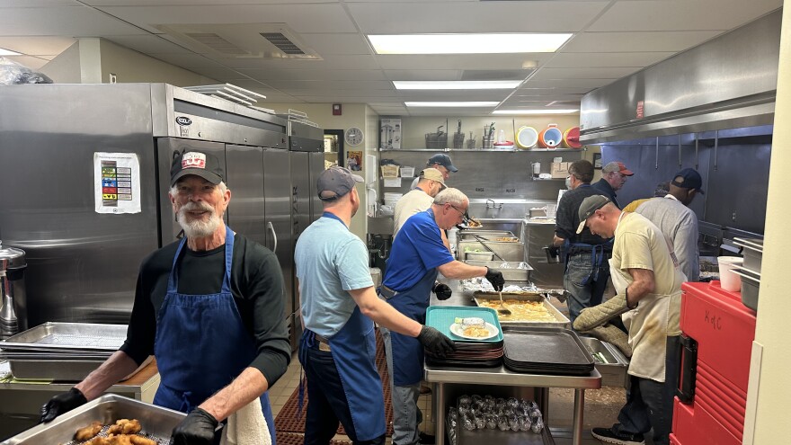 Workers at the St. Mary's fish fry in Chelsea.