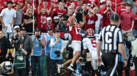 IU receiver Elijah Sarratt (13) catches a touchdown pass during the Hoosiers' victory over Alabama in the Rose Bowl.