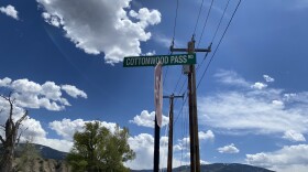 A street sign indicating the entrance to cottonwood pass road in Gypsum in Eagle COunty