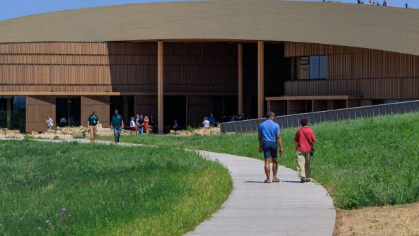Visitors walk toward the entrance of the Theodore Roosevelt Presidential Library in Medora on July 2, 2026.