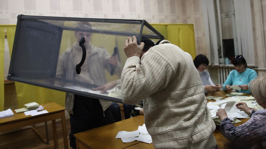 Election staff begin to count votes at a polling station in Bachchisaray, in Crimea, Ukraine, Sunday. Crimeans voted to decide whether the peninsula will break away from mainland Ukraine. The referendum has been dismissed as illegal by the West.