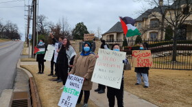 A group of protesters from Oklahomans Against Occupation protest along Lewis Avenue in Tulsa on Dec. 28, 2023.