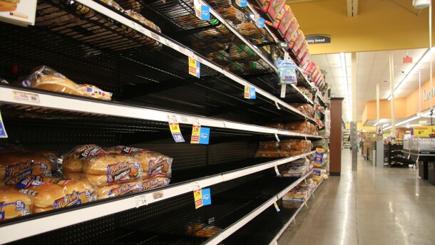 A bread aisle at Gerbes grocery store is picked through with only a few selections remaining on the shelf. 