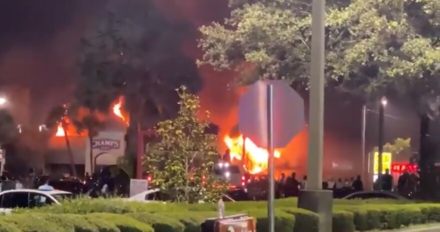 A Champs Sports store burns in Tampa on May 31, 2020, following a protest over the death of George Floyd. Terrance Lee Hester Jr., 20, pleaded guilty in Tampa federal court to starting the fire.