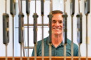 Alan Bowman stands behind the wires that ring bells at Carillon Park.