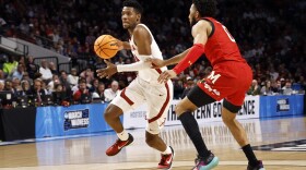 Alabama forward Brandon Miller (24) dribbles around Maryland guard Don Carey (0) in the first half of a second-round college basketball game in the NCAA Tournament in Birmingham, Ala., Saturday, March 18, 2023. (AP Photo/Butch Dill)
