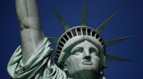 A tourist's hand is seen at the crown of the Statue of Liberty on February 19, 2019 in New York City. (Johannes Eisele/AFP/Getty Images) 