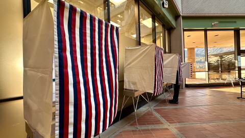 A voter casts an early vote in Juneau at the State Office Building on Oct. 26, 2026.