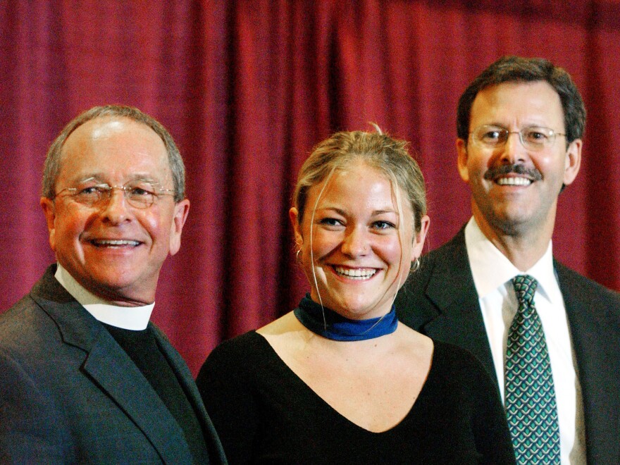 The Rev. Gene Robinson, along with his daughter Ella and partner Mark Andrew, attend a news conference after Robinson was confirmed as bishop of the Episcopal Church in Minneapolis in 2003. Robinson was the church's first openly gay bishop, and his daughter is an advocate for gay marriage.