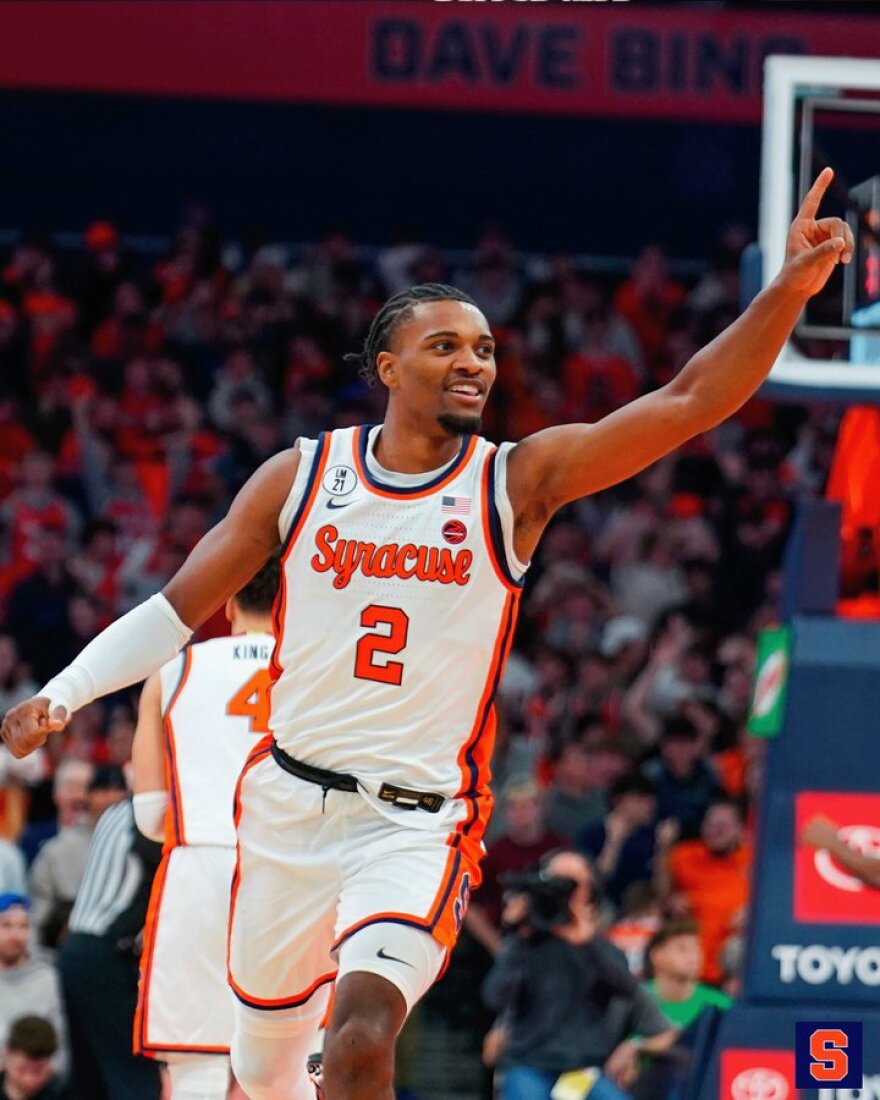 JJ Starling (2, White) celebrates a three-pointer in Syracuse’s upset over No. 13 Tennessee.