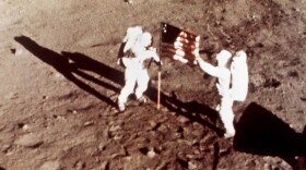 Apollo 11 astronauts Neil Armstrong and Edwin E. "Buzz" Aldrin, the first men to land on the moon, plant the U.S. flag on the lunar surface, July 20, 1969. (NASA via AP)