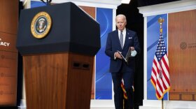 President Joe Biden arrives to deliver closing remarks to the virtual Summit for Democracy, in the South Court Auditorium on the White House campus, Friday, Dec. 10, 2021, in Washington. (AP Photo/Evan Vucci)