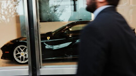Ferrari automobiles are displayed in a Manhattan window on Sept. 28, 2017 in New York City. The Trump administration's tax overhaul plan quickly drew attention for the benefits it would give to wealthy Americans, including members of the Trump family. Among other things the plan calls for eliminating the federal estate tax, and for cutting the corporate tax rate from 35 to 20 percent.  (Spencer Platt/Getty Images)
