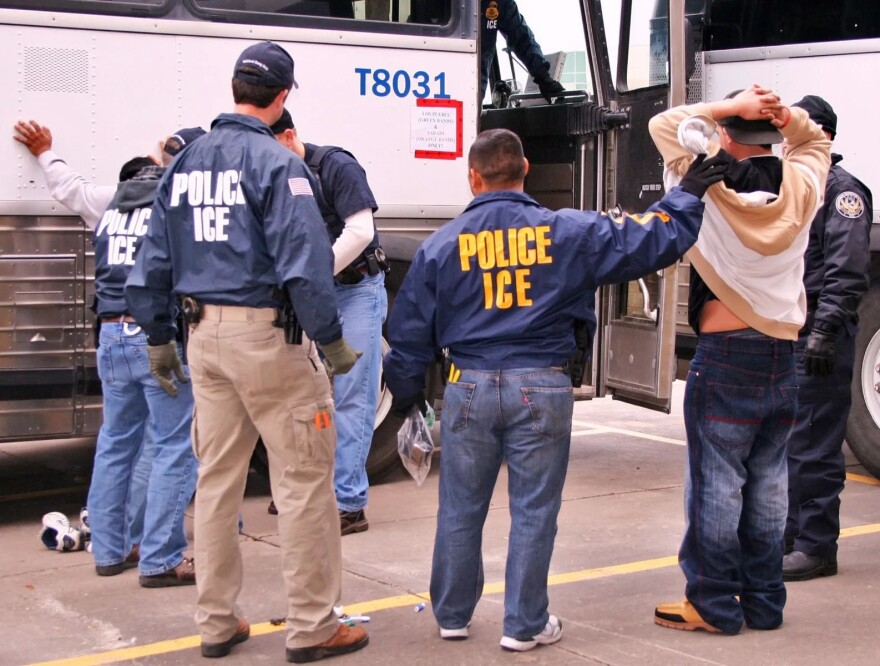 U.S. Immigrations and Customs Enforcement (ICE) agents arrest people during a raid in Houston, Texas, February 2010.