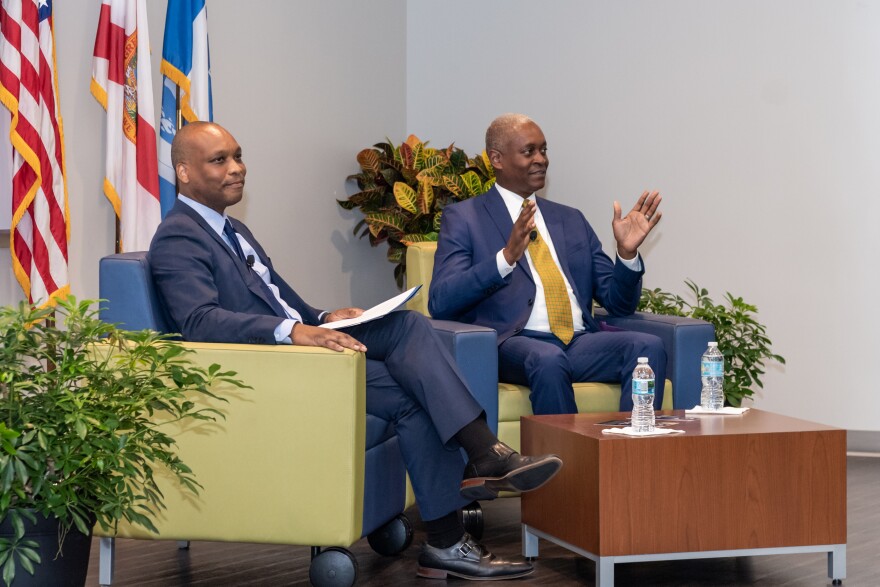 Federal Reserve Bank of Atlanta Pres. Raphael Bostic (right) speaks with Broward College Pres. Gregory Haile on Sept. 7, 2023.