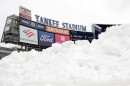 Snow is seen piled up on the field before the Pinstripe Bowl NCAA college football game between Clemson and Penn State at Yankee Stadium Saturday, Dec. 27, 2025, in New York. (AP Photo/Adam Hunger)