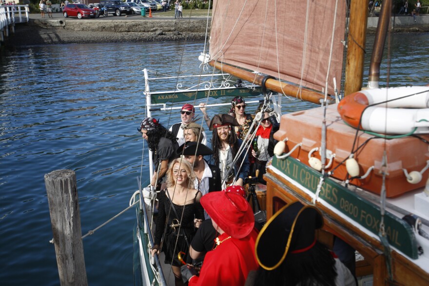 The Pastafarian wedding party on a pirate-themed boat.