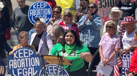 A group of mostly women rally in support of abortion access.