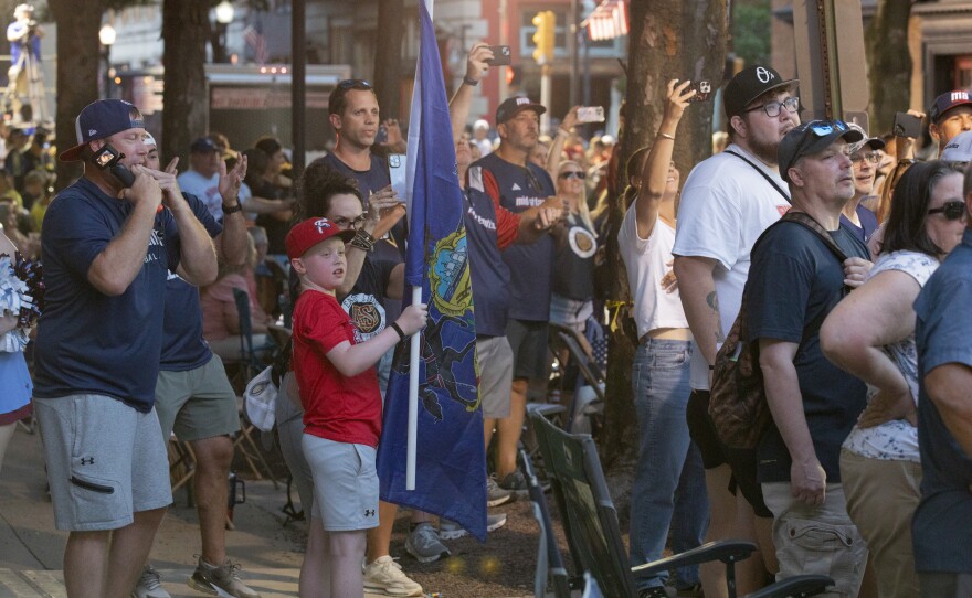 Fans of the Mid-Atlantic team, from West Chester, Pennsylvania, wait for the team's float to come down West Fourth Street during the Little League World Series parade.