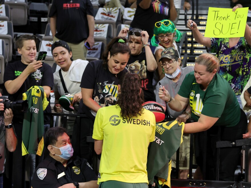Bird signs autographs for fans before Game Two of the 2022 WNBA Playoffs semifinals in August.