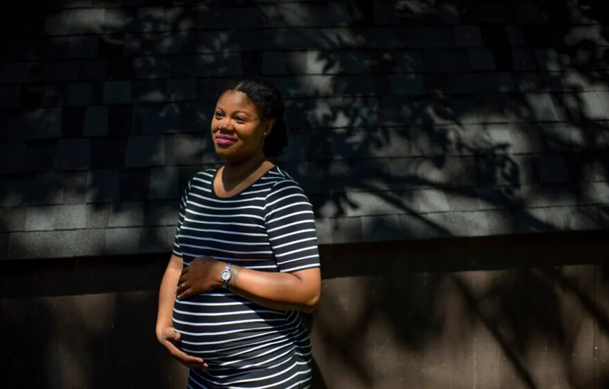 Joy Tucker outside her home in Deer Park. 
