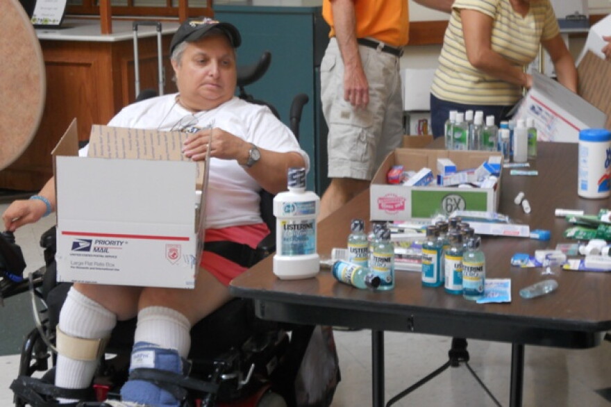 Weinberg resident Marietta Calabrese helps pack boxes for the troops. She serves on the Gilda Tunis Soldiers Fund