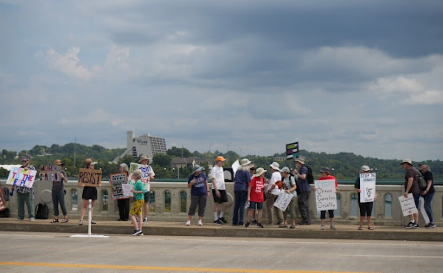 Demonstrators participate in Indivisible Knoxville’s 'Labor of Love' protest on Henley Street Bridge in Knoxville on September 1, 2025.