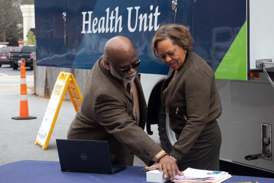 Pastor Joseph Parks (left) and state Rep. Rosalyn Henderson-Myers (right) speak outside of Grace Community Church in Spartanburg.
