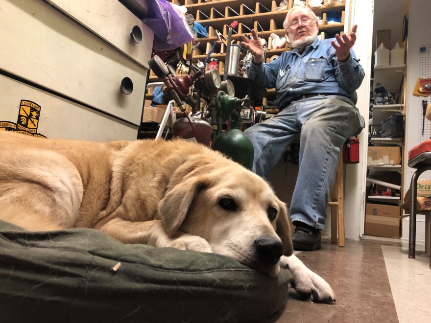 Sam, Don's yellow lab, joins him at work.