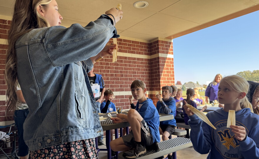 Brynlee Wilson from the Wyandotte Nation taught students how to make flowers from corn husks.