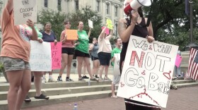 Protesters gathered at the Indiana Statehouse last year ahead of a special legislative session in which lawmakers passed a near-total abortion ban. The ban was temporarily halted after a challenge was heard by the Indiana Supreme Court. It takes effect Aug. 1.