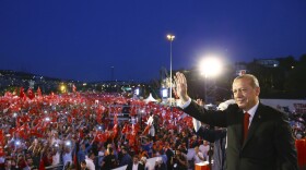 Turkey's President Recep Tayyip Erdogan waves to his supporters as he arrives to commemorate the one year anniversary of the July 15, 2016 failed coup attempt, in Istanbul, Saturday.