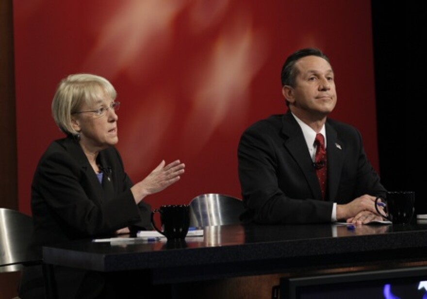 Patty Murray and Dino Rossi are in a tight race. They're shown here at last week's debate in Seattle.