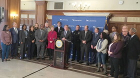 Mayor Jim Gray announced plans for the lawsuit with a group of members of the faith-based community. representatives of social service agencies, police officers, firefighters, corrections officers, a parent who lost a child to drug overdose and a woman who turned her life around through treatment.