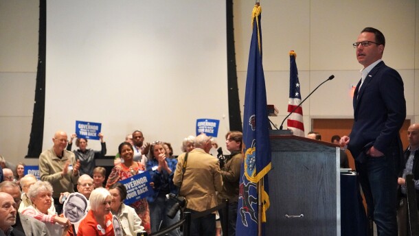 Gov. Josh Shapiro (right, at podium) spoke to nearly 400 people at the Penn Stater in State College Saturday morning. Shapiro and other Democrats are rallying voters ahead of this year's midterm elections. 