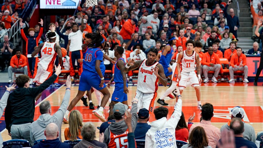 Forward Donnie Freeman (1, White) reacting to a bucket against SMU on Saturday.