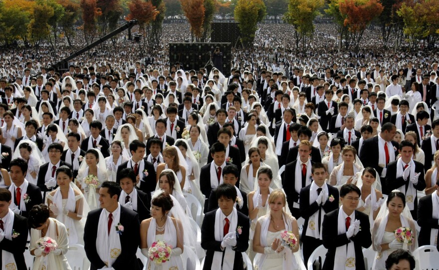 Couples from around the world participate in a mass wedding ceremony arranged by the Rev. Sun Myung Moon's Unification Church in South Korea in 2009.