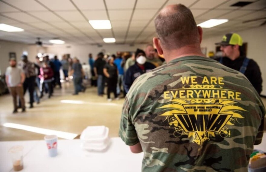 Coal miners on strike stand in line to pick up their strike checks on March 23, 2022, in Brookwood, Alabama. (Andi Rice, for the Gulf States Newsroom)