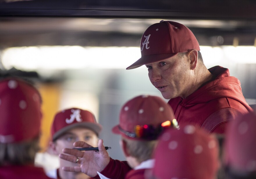 FILE - Alabama coach Brad Bohannon talks with the team in the dugout after Alabama rallied in the bottom of the ninth for a 5-4 win over Xavier in an NCAA college baseball game Feb. 18, 2022, in Tuscaloosa, Ala. An Indiana man whose son is a member of the University of Cincinnati baseball team is the bettor at the center of separate investigations that led to firings of Bohannon and two members of the Cincinnati baseball staff this month, two people familiar with the inquiries told The Associated Press on Friday, May 26. (AP Photo/Vasha Hunt, File)