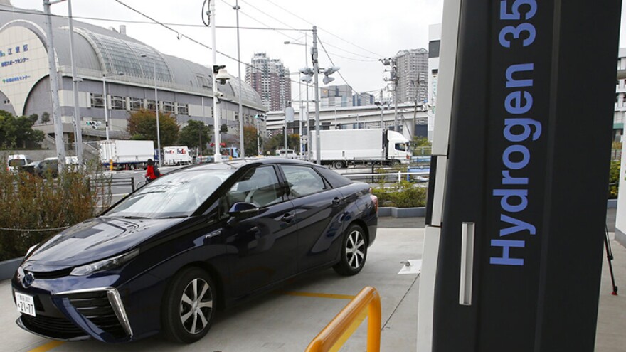 FILE - A Toyota Motor Corp.'s new hydrogen fuel cell vehicle Mirai arrives at a charge station near Toyota's showroom on Nov. 17, 2014, in Tokyo. Seven Midwestern states are teaming up to accelerate the development of hydrogen as a clean-energy alternative for automobiles and factories that rely largely on climate-warming fossil fuels, governors said Monday, Sept. 19, 2022.