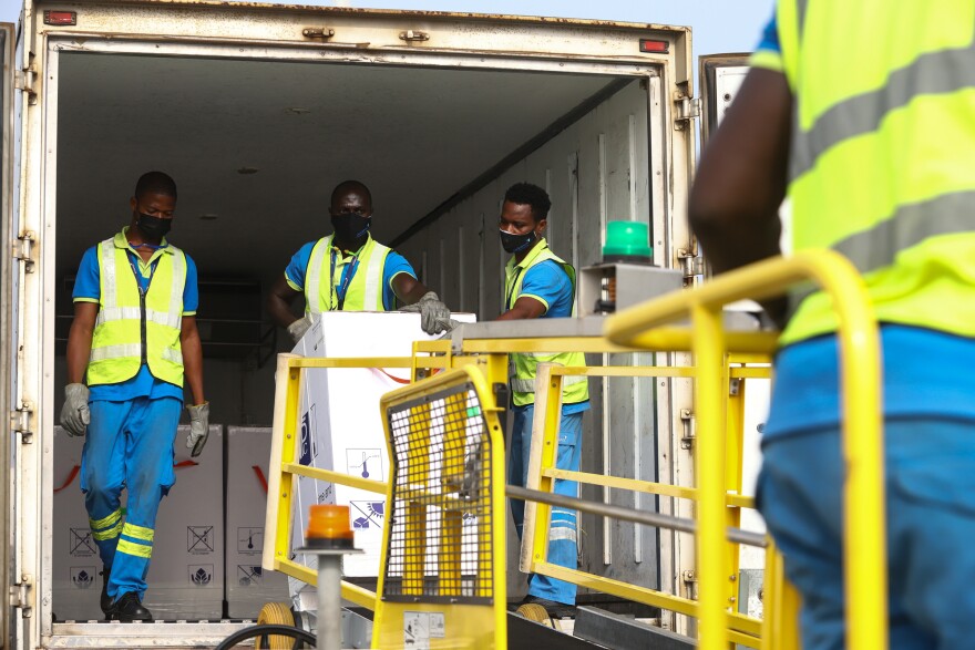 Ghana is the first country to receive a shipment of COVID-19 vaccines from the global COVAX program. Above: The vaccines are unloaded at the Kotoka International Airport in Accra on February 24.