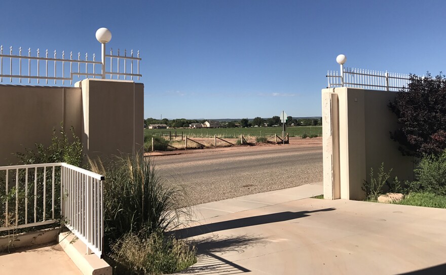 Looking out through the gates surrounding a large house that was built for FLDS leader Warren Jeffs, but is now a privately owned bed and breakfast.
